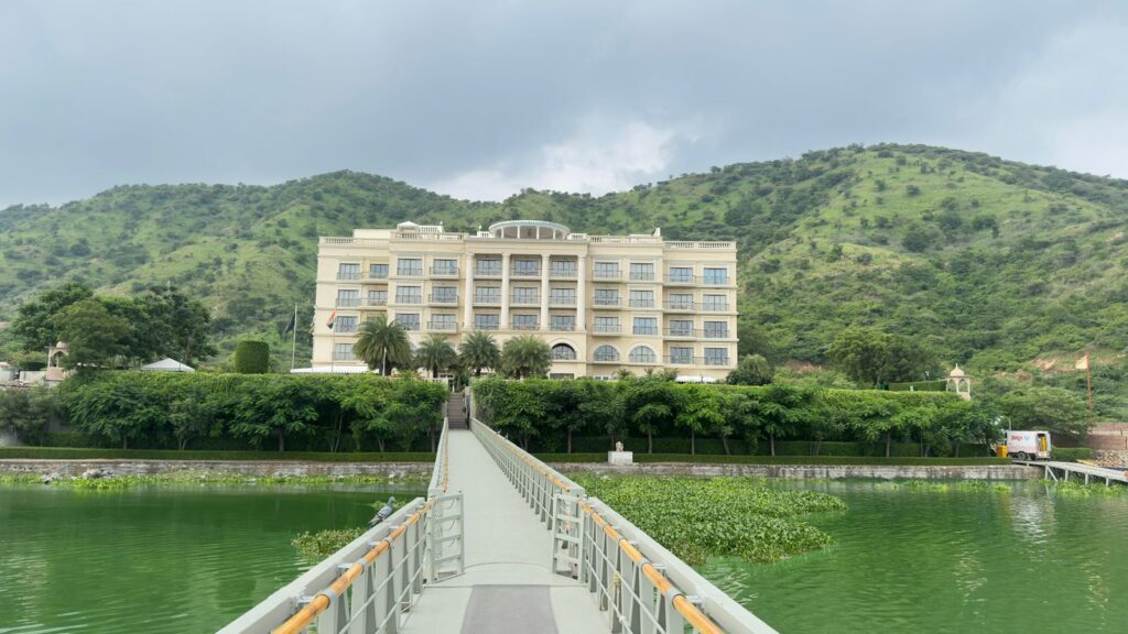 Exterior view of the Lakeshore Building at Raffles Udaipur, near the hotel's entrance and separated from the main island