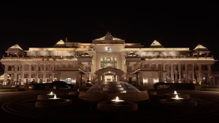 ITC Grand Bharat Gurugram main palace facade lit up at night with fountains in front