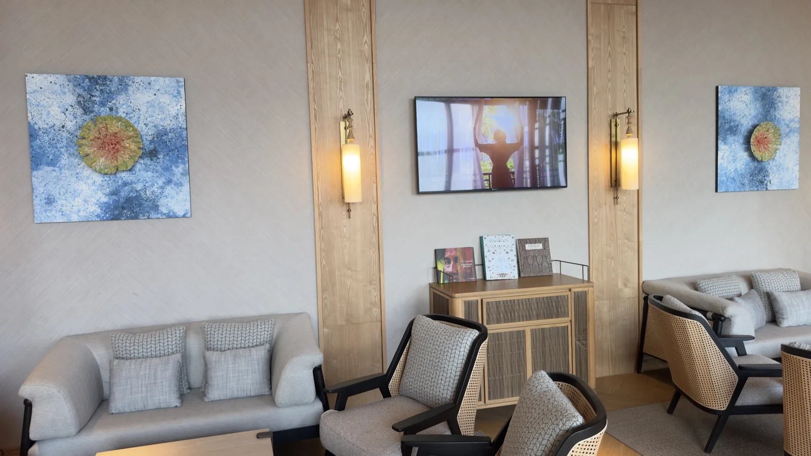 Executive Lounge seating at Hilton Burau Bay Langkawi with rattan chairs, sofas and blue artwork